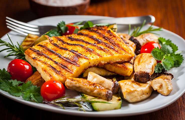Halloumi grilled cheese on mushrooms and vegetables